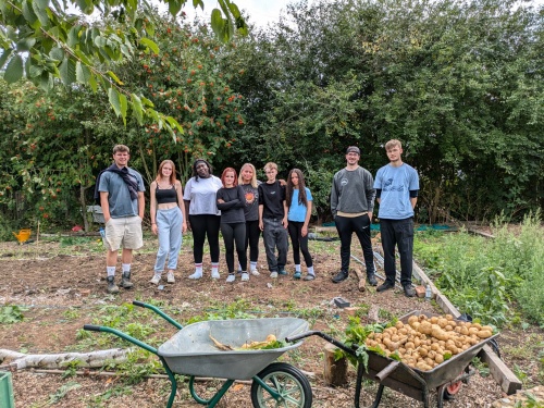 House Project Peterborough volunteering at the Green Back Yard